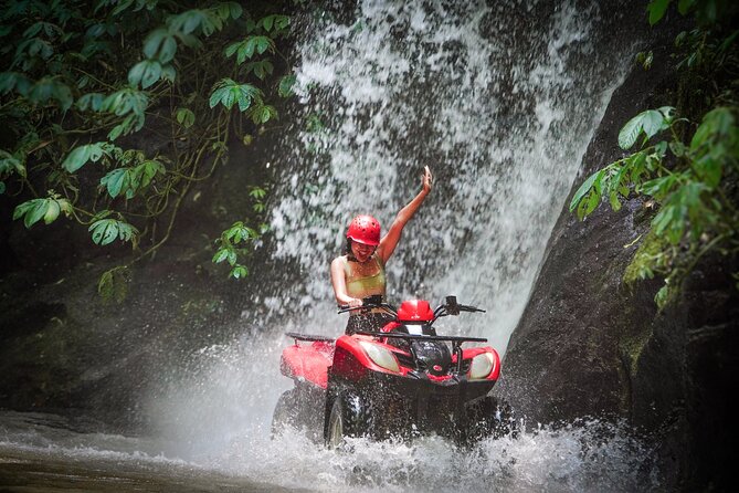 ATV Quad Bike Kuber Through Waterfall, Tunnel And Rice Field - Following waterfalls and wet countryside