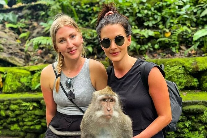 Bali Swing, Monkey Forest and Waterfall Private Tour - Kanto Lampo Waterfall: rock shelves and shallow water