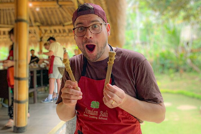 Balinese Farm Cooking Class by Pemulan Bali - Picking ingredients at the organic farm