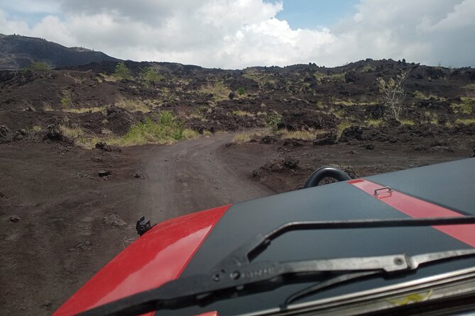Batur Volcano Sunrise And Black Lava Jeep Adventure Tour - Walking across black lava and sand
