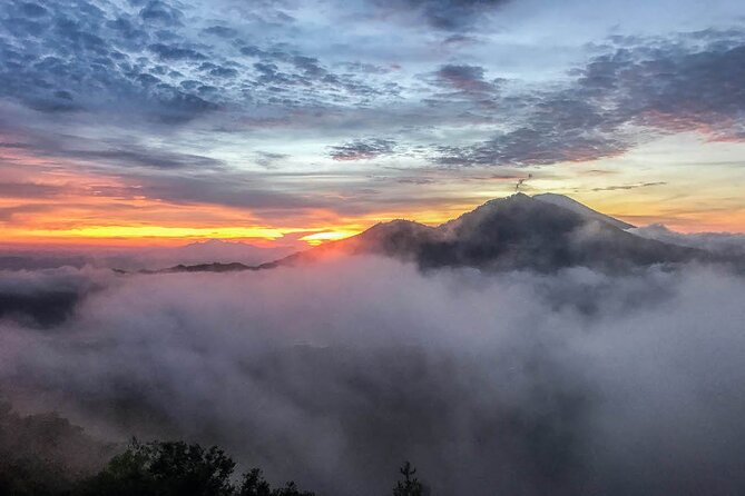 Mount Batur Sunrise Trek & Natural Hot Spring Experience - Reaching the summit and watching the sun rise