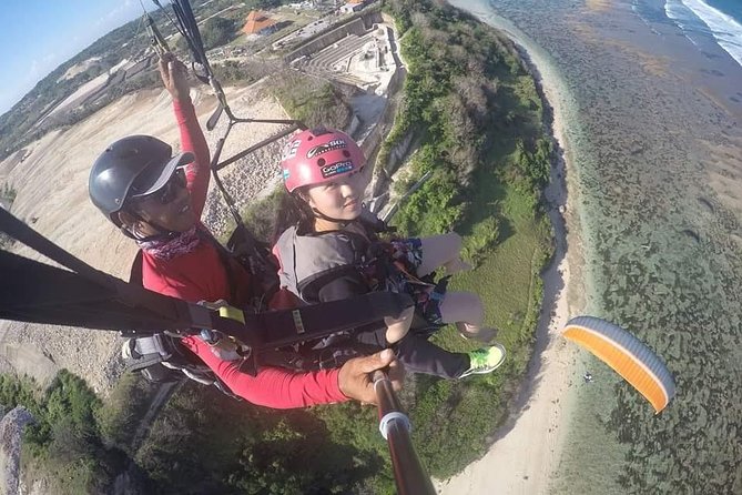 Paragliding Bali at Uluwatu Cliff with Photos/Videos - Booking, Weather, and Cancellation Details