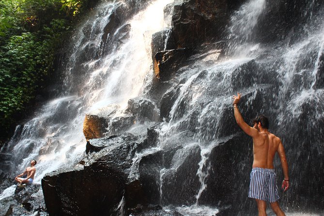 Private Waterfall Tour Feature Tukad Cepung, Tibumana and Kanto Lampo - Kanto Lampo: water over sculpted rocks