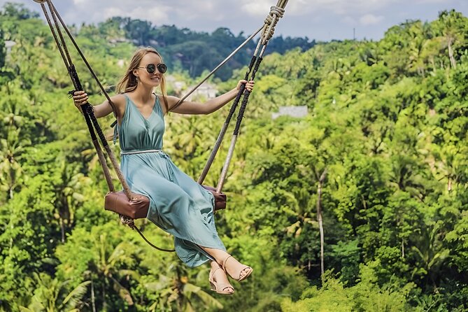 Ubud Tour with Monkey Forest Waterfalls Temples and More - Cooling off at Tegenungan Waterfall